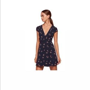 REFORMATION OYSTER NAVY FLORAL WRAP DRESS